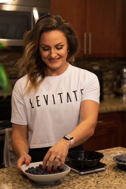 Coach Liz is preparing food.